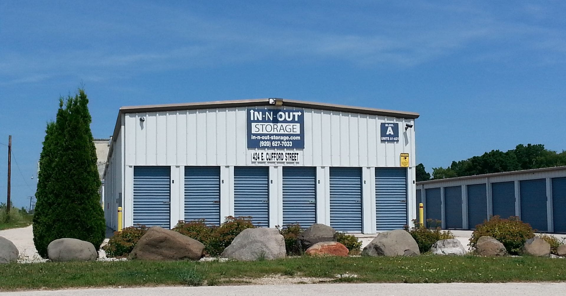 white building with blue doors; Self Storage building - Clifford North